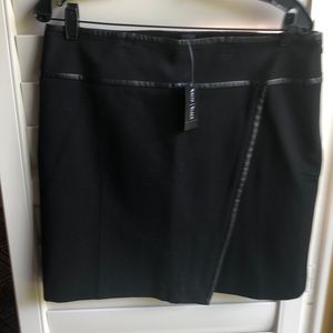Washable black skirt, faux leather trim. Never worn.